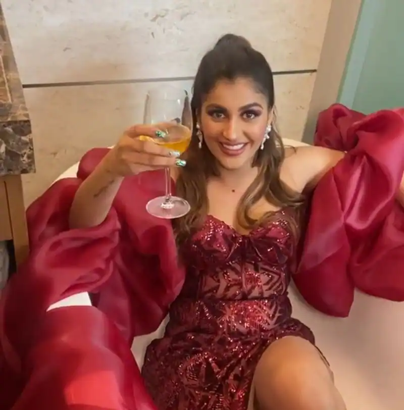 Actress yashika anandh hot photos in red dress with drinks in hand