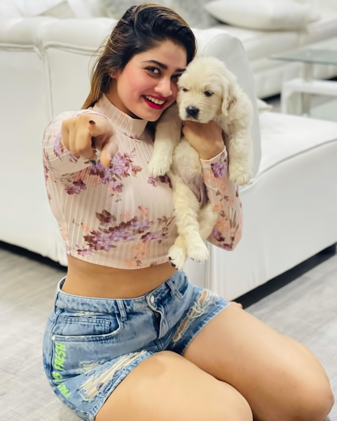 Actress shivani narayanan playing with puppy with trouser and tops