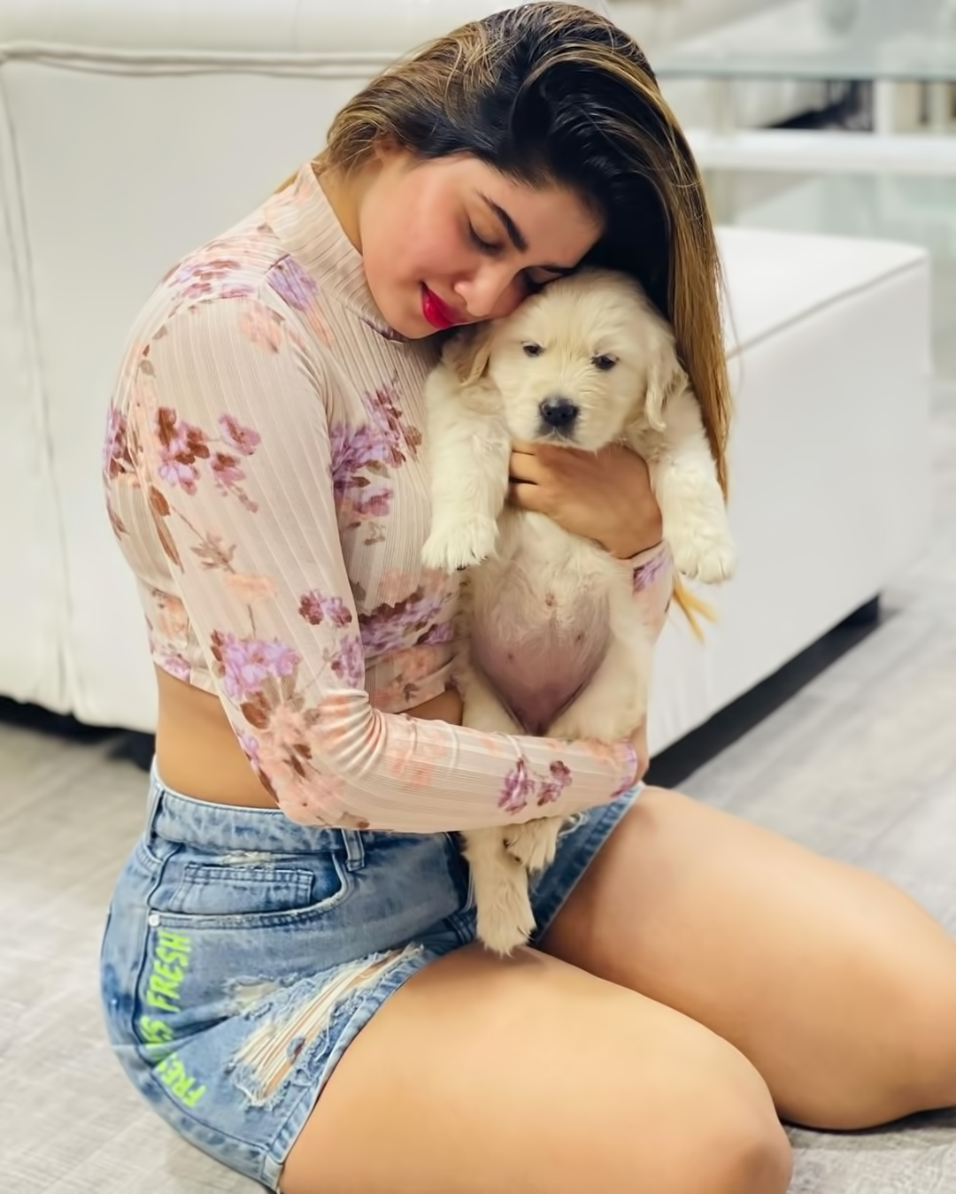 Actress shivani narayanan playing with puppy with trouser and tops