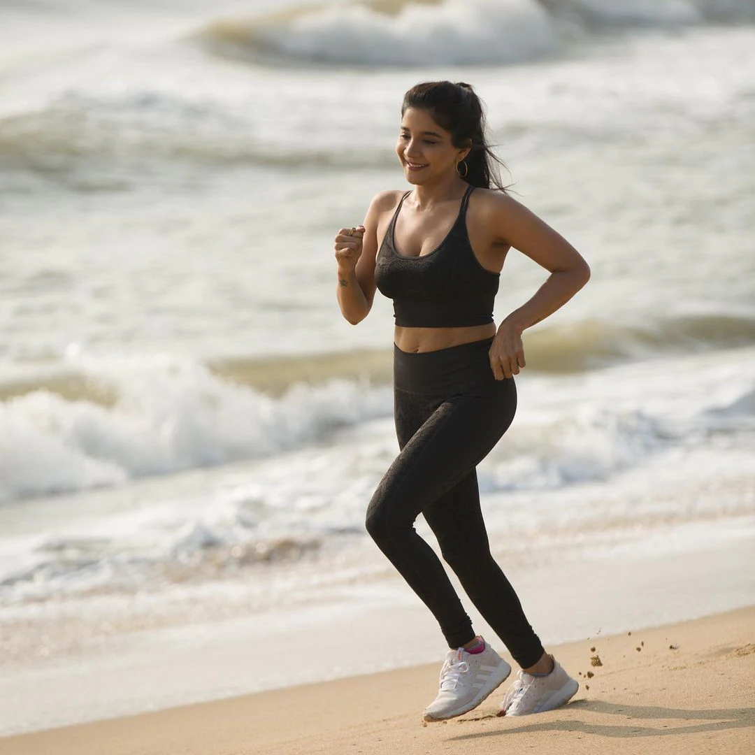 Actress sakshi agarwal hot photos in yoga dress along beach seashore