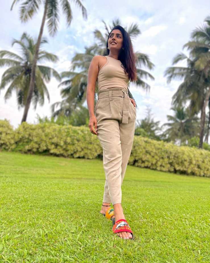 Actress eesha rebba hot photos holding flower in lips