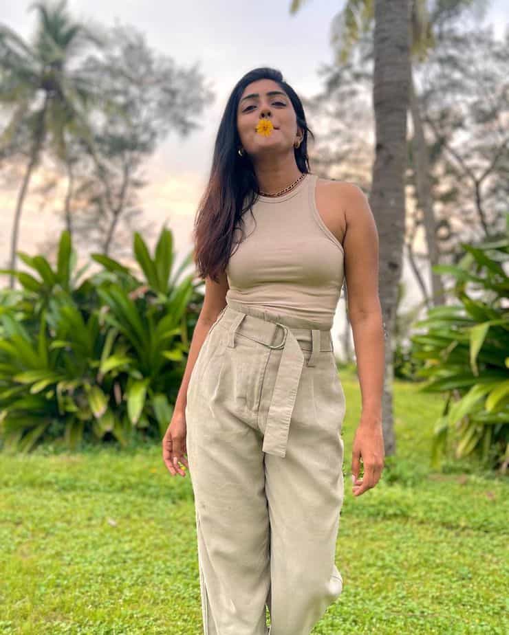 Actress eesha rebba hot photos holding flower in lips