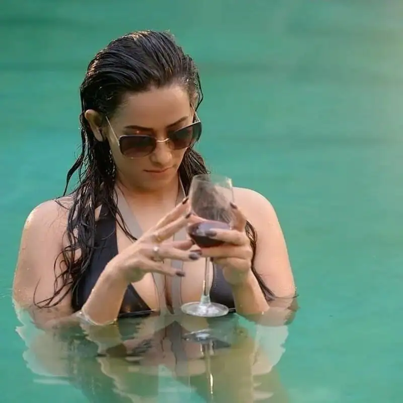 Actress sanjana singh hot photos with drinks in swimming pool in bikini dress
