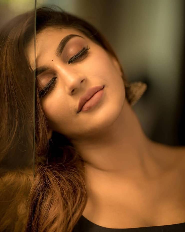 Actress yashika anandh hot photos in black colour saree and open neck blouse