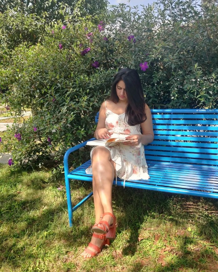 Poonam bajwa hot photos reading book siting in short dress