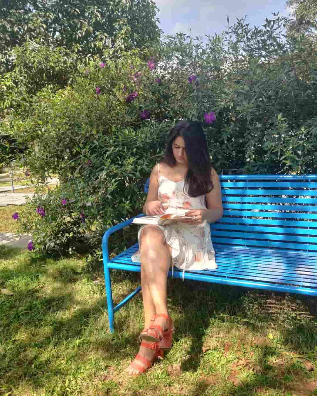 Poonam bajwa hot photos reading book siting in short dress