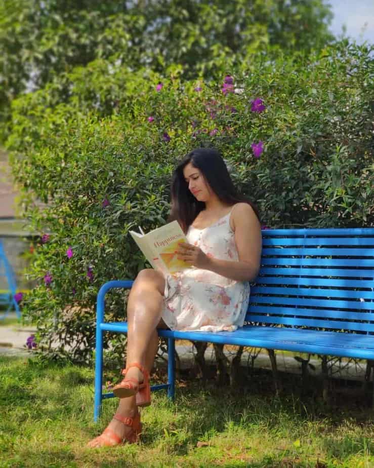 Poonam bajwa hot photos reading book siting in short dress