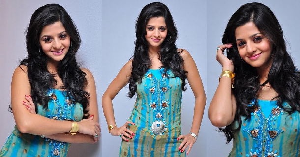 Vedhika hot posing in biking pose along beach side