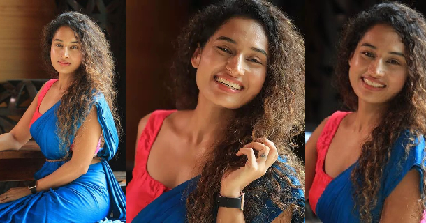 Pooja ramachandran glamour pics in tight shorts and red tops