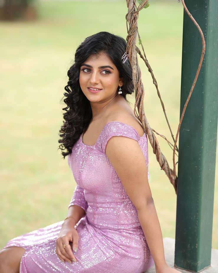 Gabriella charlton glamour pose in short purple dress curling hair