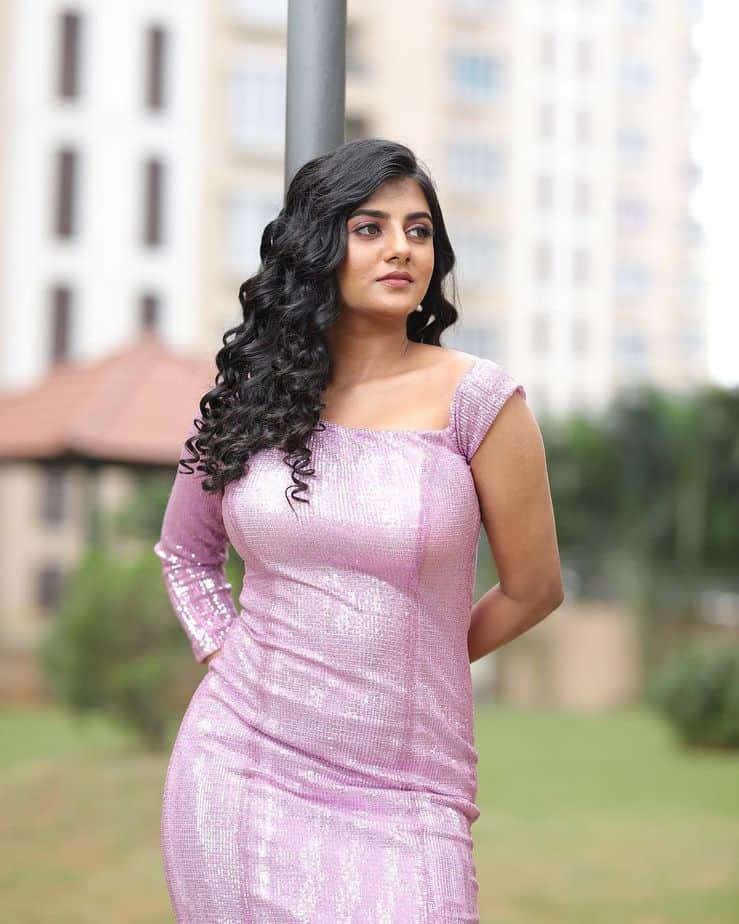 Gabriella charlton glamour pose in short purple dress curling hair