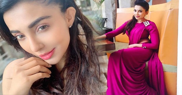 Parvati nair hot posing on bed in red colour light trending on social media