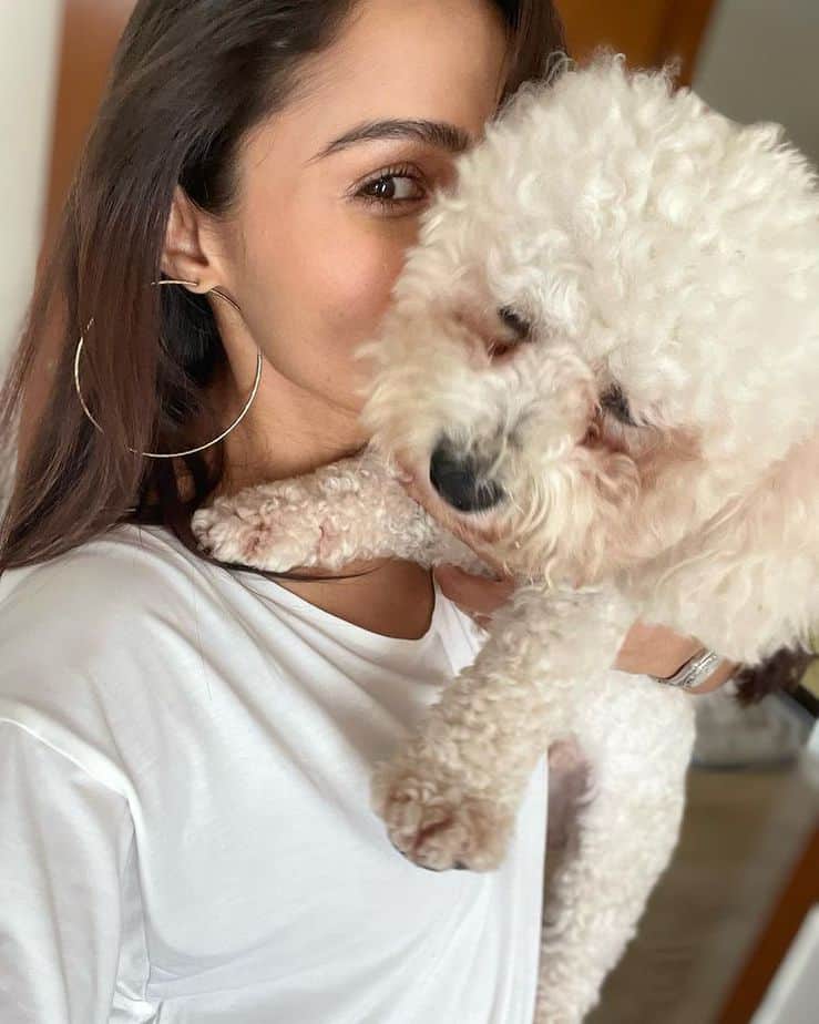 Andrea jermiah playing and posing with her cute pet dog goes viral