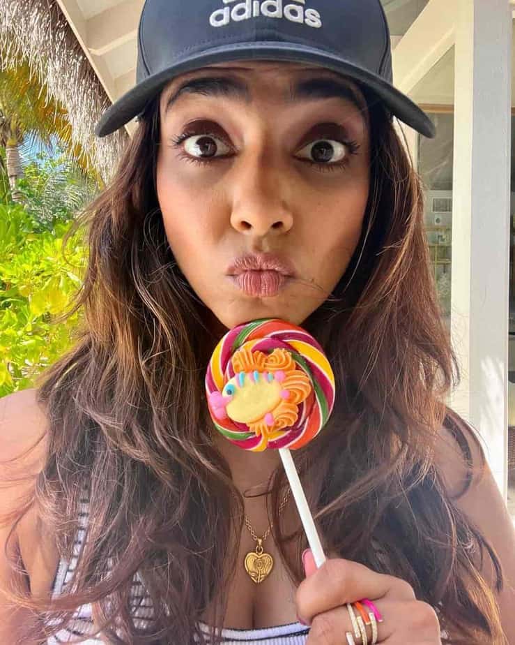 Malavika mohanan posing with lollipop with a different caption