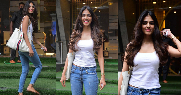 Malavika mohanan posing with lollipop with a different caption