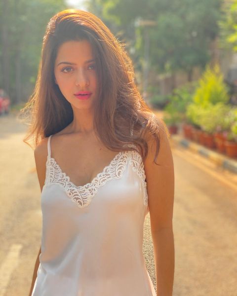 Vedhika hot photos in white soft slip glamour dress