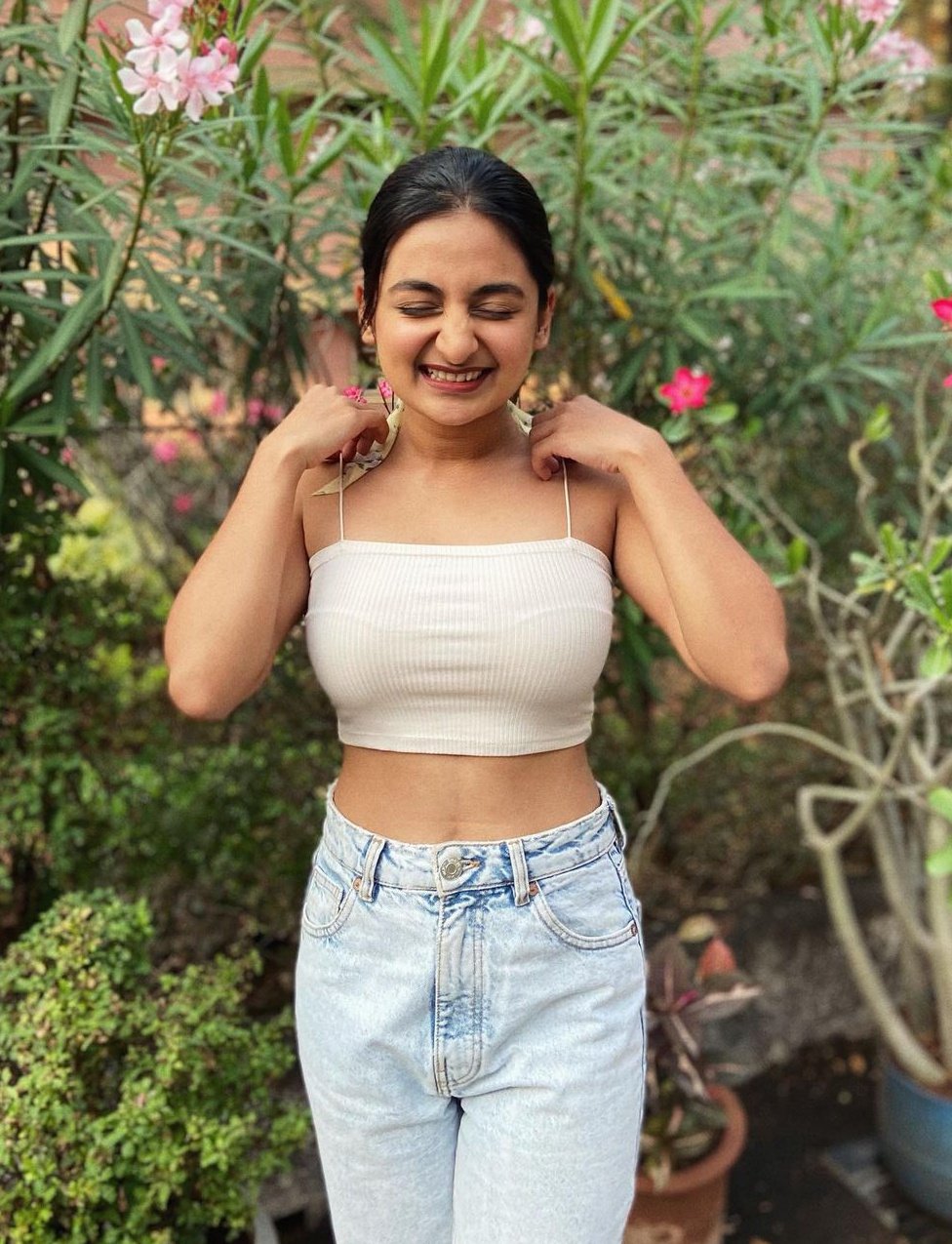 Esther anil posing in white colour hot slip hot photoshoot