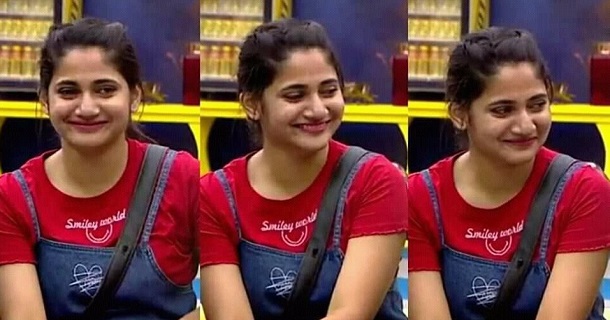 Losliya posing hot in glamour dress with knot tied at back