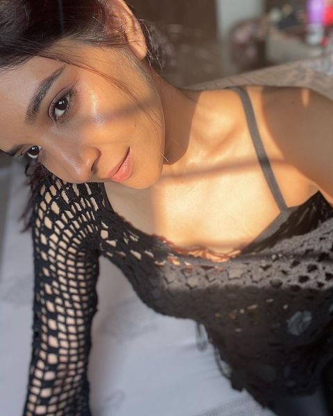 Sakshi agarwal photos in sunlight with black netted over coat dress