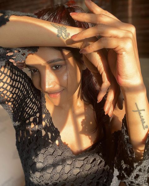 Sakshi agarwal photos in sunlight with black netted over coat dress