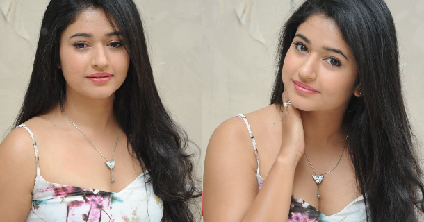 Poonam bajwa posing along seashore in hot sleeveless red dress