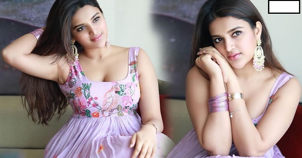 Nidhi agarwal glamour photoshoot in hot short dresses on bed
