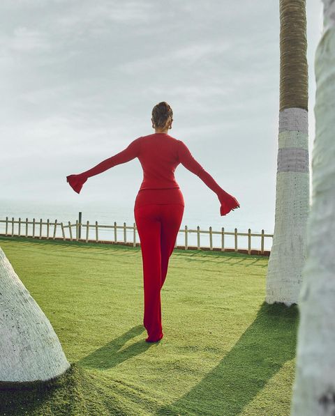 Pooja hegde posing in red hot modern dress photoshoot