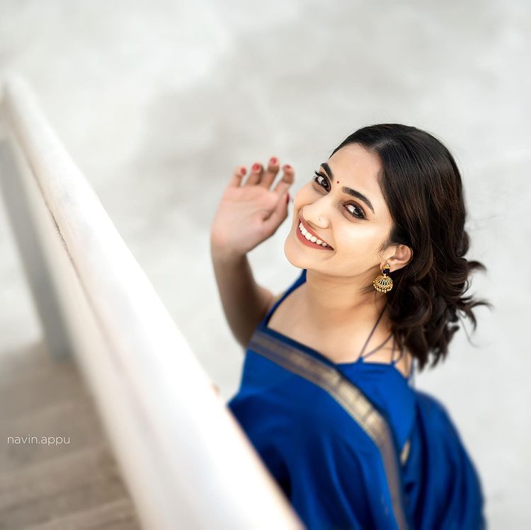 Losliya hot photos in blue colour saree and back open blouse