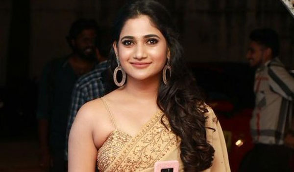 Losliya hot photos in blue colour saree and back open blouse