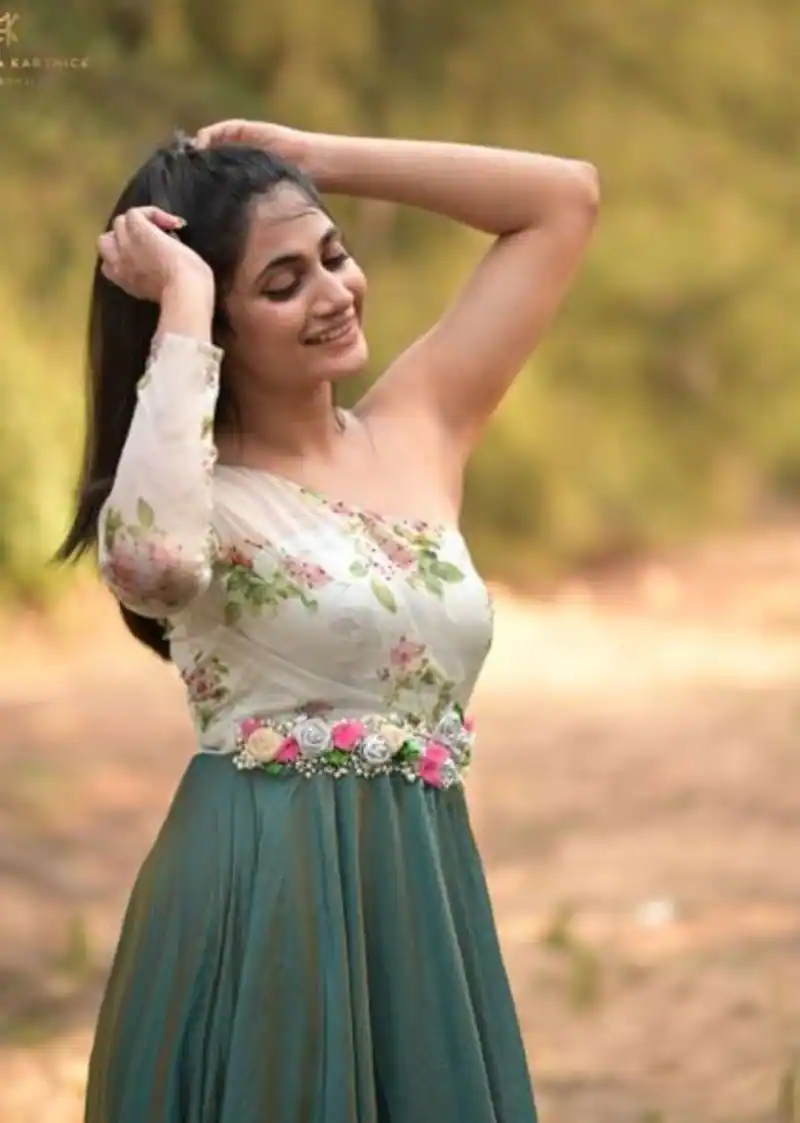 Losliya hot photos in blue colour saree and back open blouse