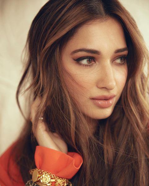 Tamanna bhatia orange suit hot photos impressing fans