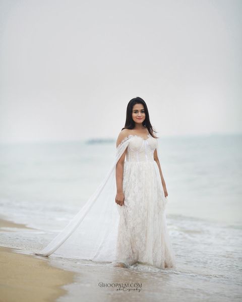 Kavya arivumani hot posing in bridal white dress cute photos