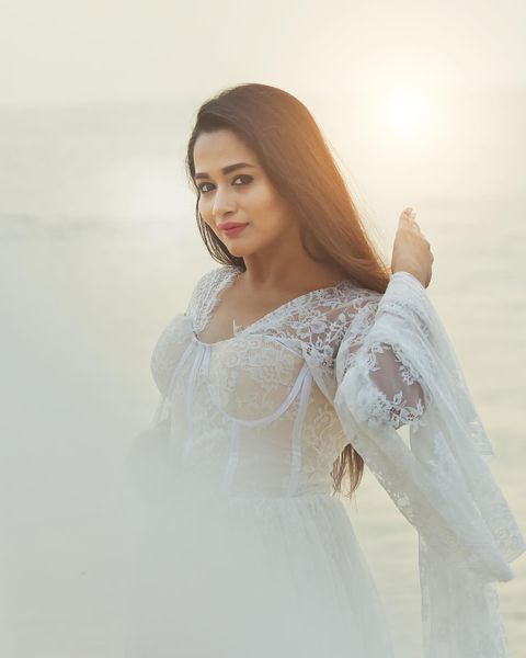 Kavya arivumani hot posing in bridal white dress cute photos