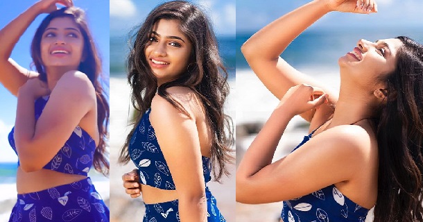 Vj archana hot posing in black velvet mini dress