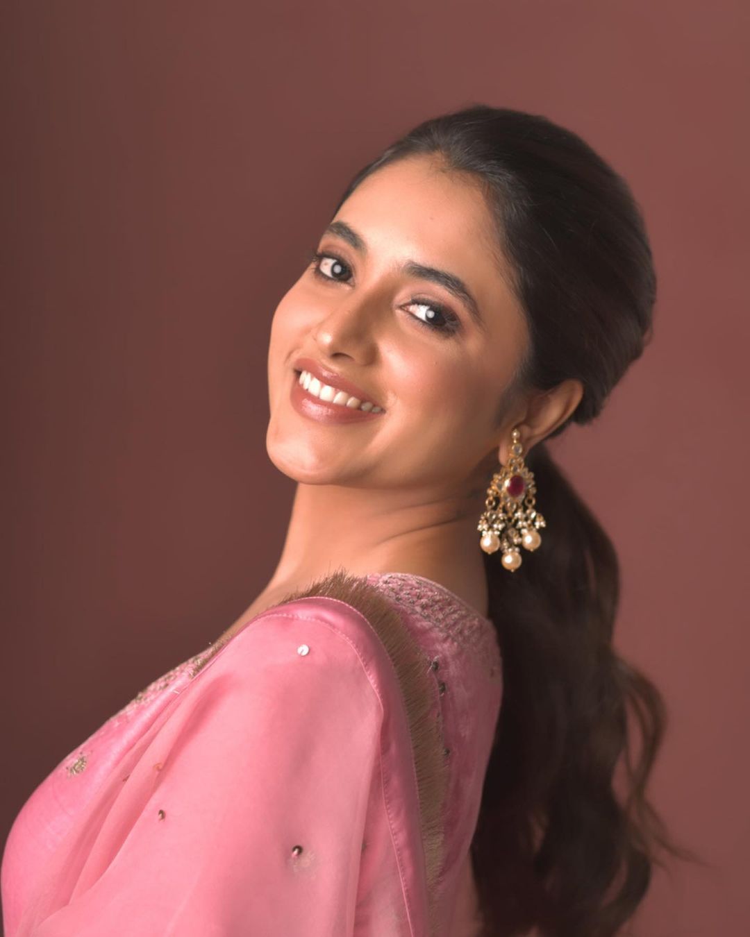 Priyanka mohan hot hip show in red grand lehenga photoshoot