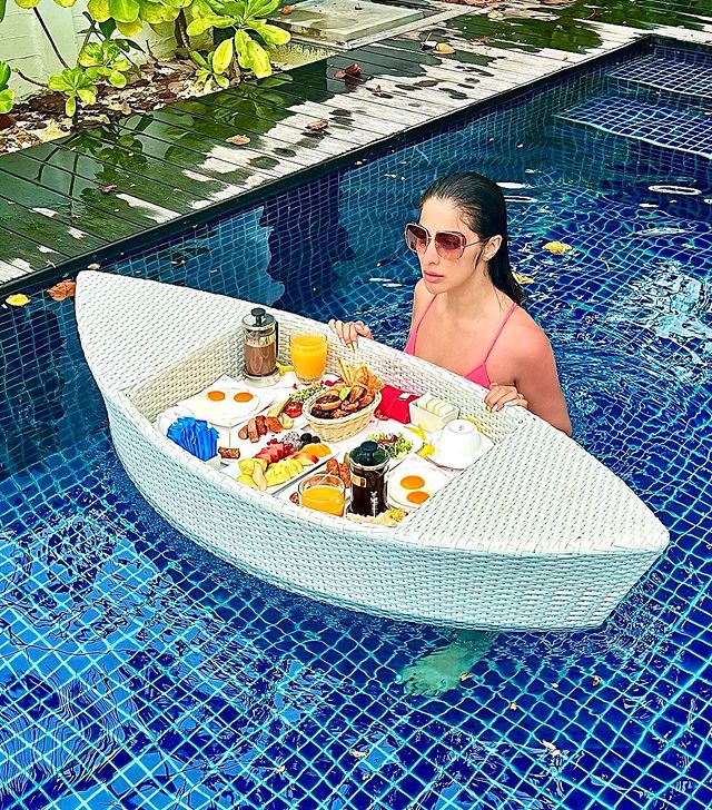 Raai laxmi hot stills having breakfast in bikini