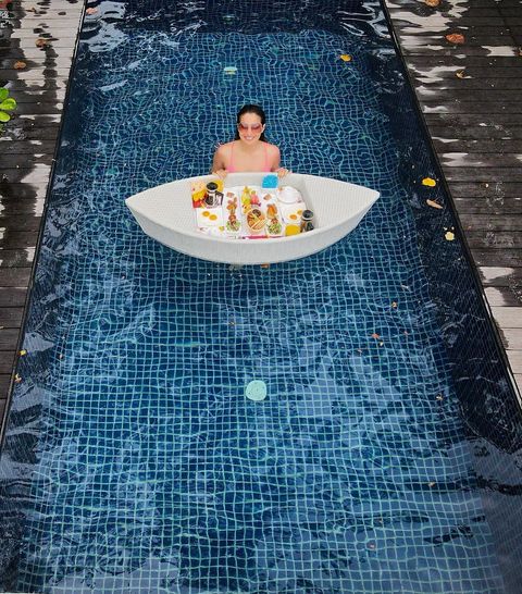 Raai laxmi hot stills having breakfast in bikini