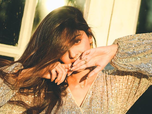 Vedhika hot shining dress photos in sunny climate