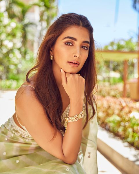 Pooja hegde hot photoshoot in transparent saree and low neck blouse