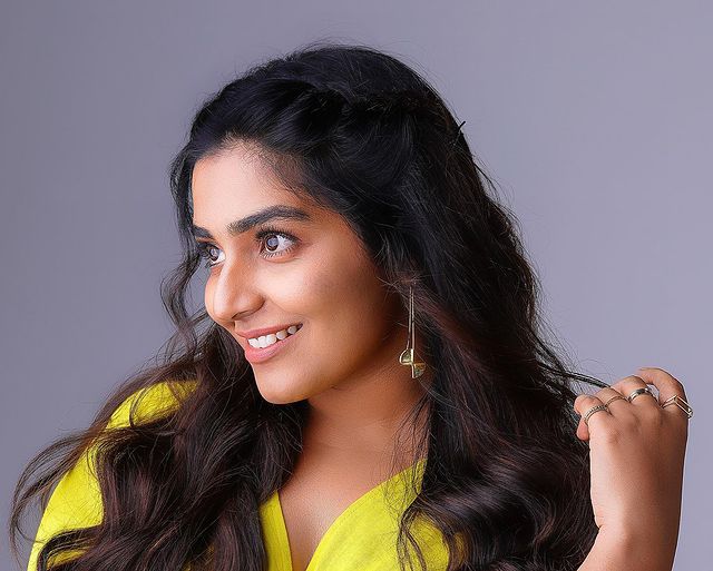 Rajisha vijayan hot yellow short dress photos posted on instagram