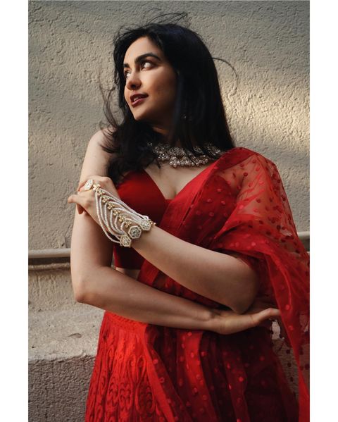 Adah sharma hot posing in red colour grand lehenga