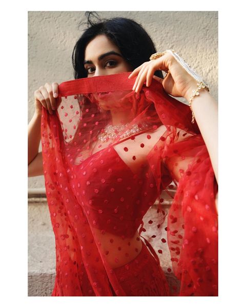 Adah sharma hot posing in red colour grand lehenga