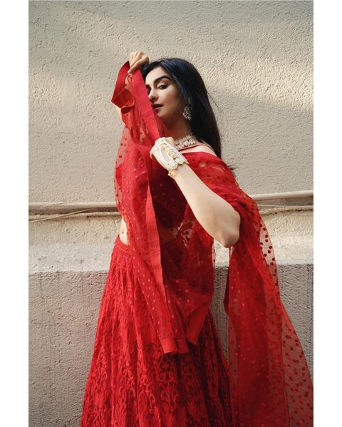 Adah sharma hot posing in red colour grand lehenga