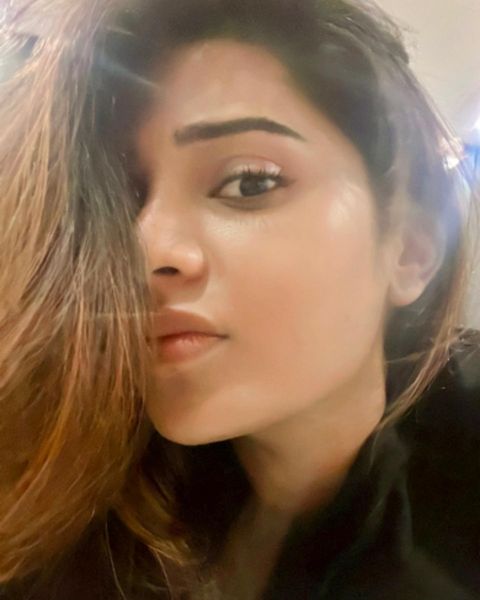 Aathmika hot photos in close up expressions on bed