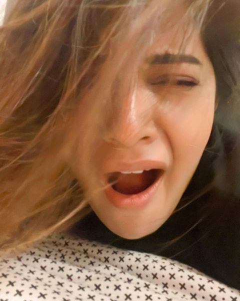 Aathmika hot photos in close up expressions on bed