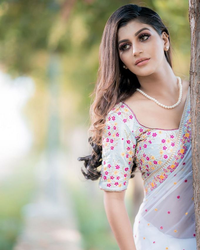 yashika anandh roaming in glamour dress in london where others are preventing themselves from winter netizens slamming yashika